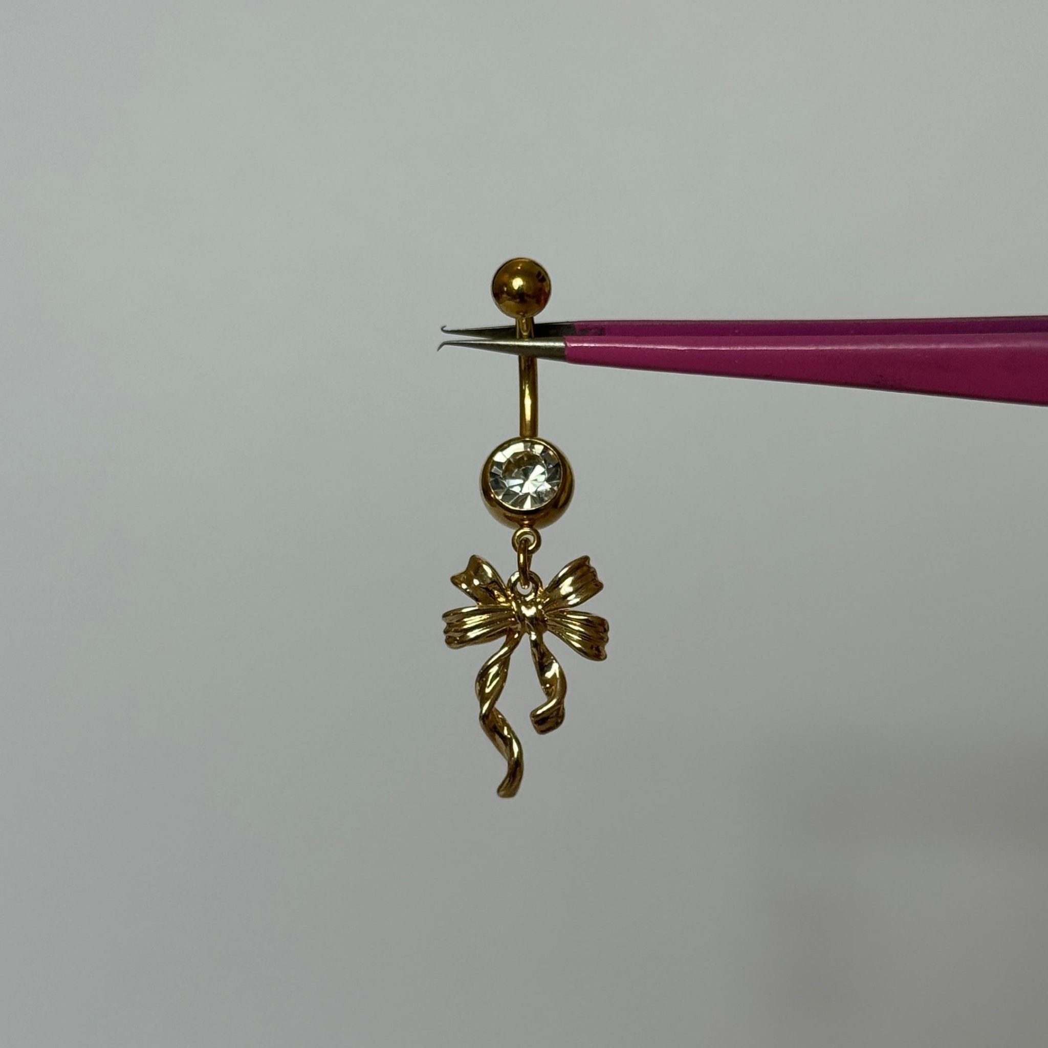 Gold Dangling Ribbon Belly Bar - ILLUSIVE JEWELS